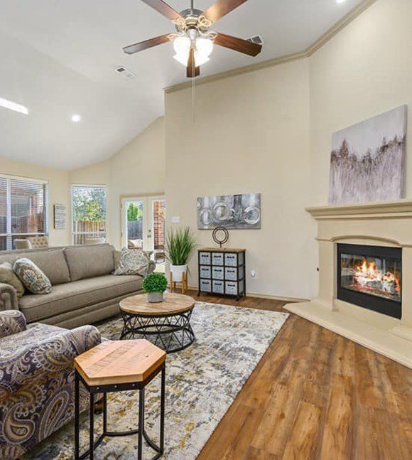 Living room with hardwood flooring and large area rug