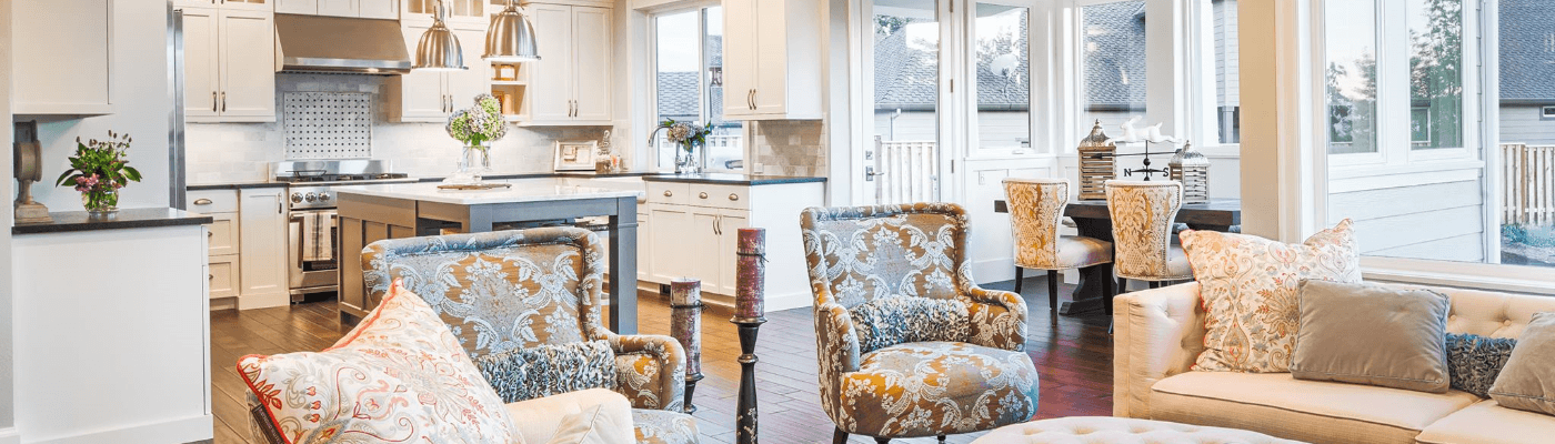 Wood flooring throughout open floor plan living room dining room and kitchen