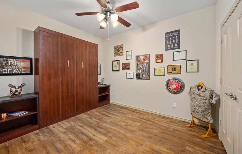 New flooring in room decorated with military memorabelia