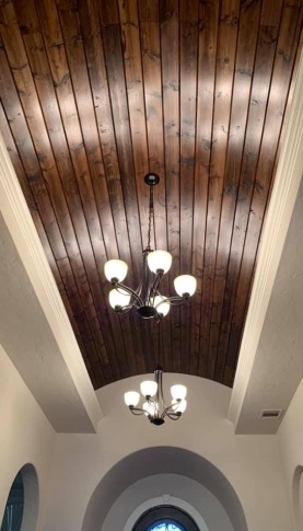 Newly installed wood planking on the ceiling