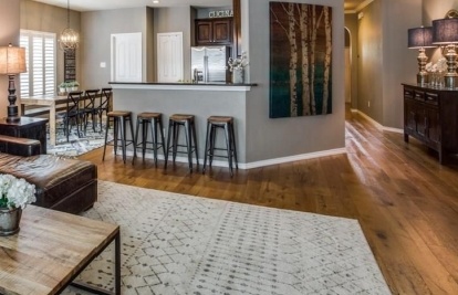 Open floor plan home with wood floors