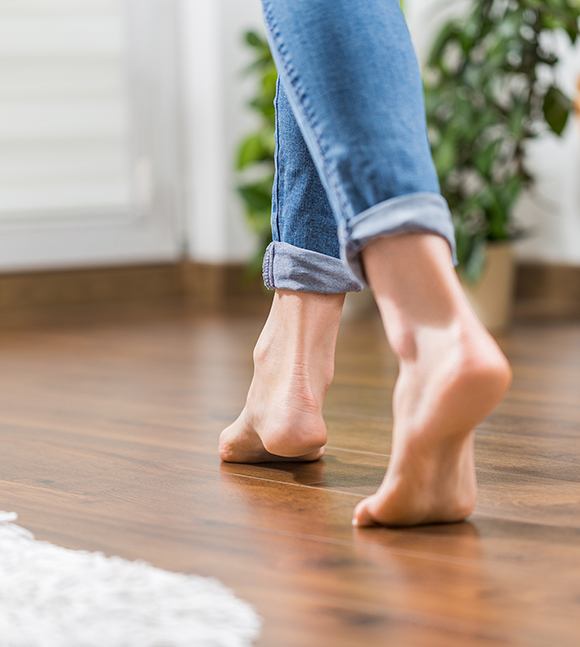Woman walking on laminate flooring