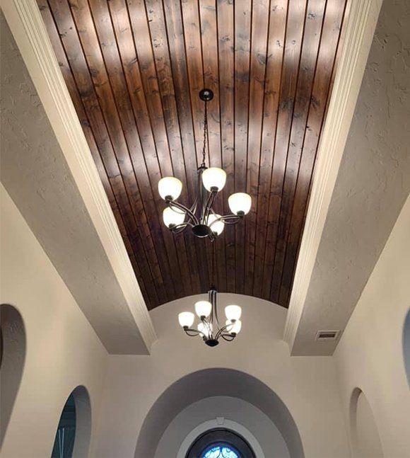 High ceiling with exposed wood planking