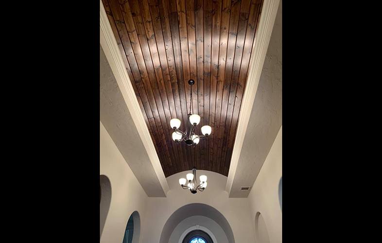 Unique exposed wood planking on ceiling
