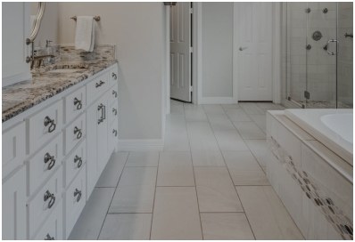 Beautiful light colored tile flooring in bathroom