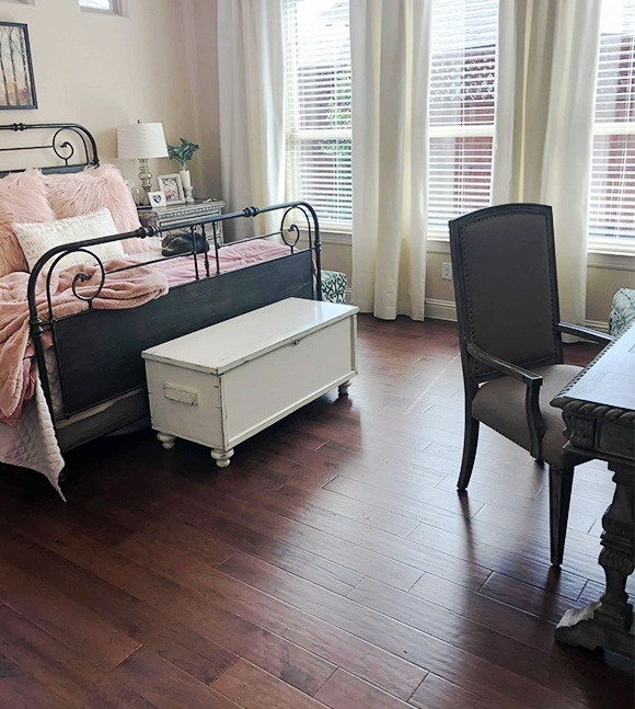 Hardwood flooring in feminine bedroom