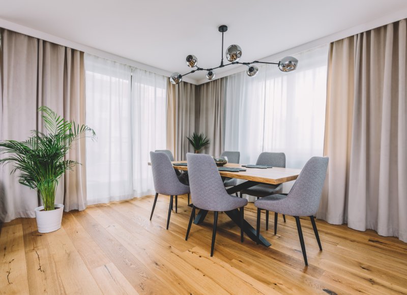 an image of a dining room table and chairs on top of hardwood floors