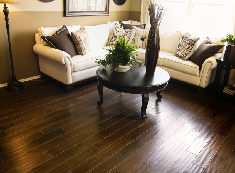 an image of a living room with refinished hardwood flooring in Keller