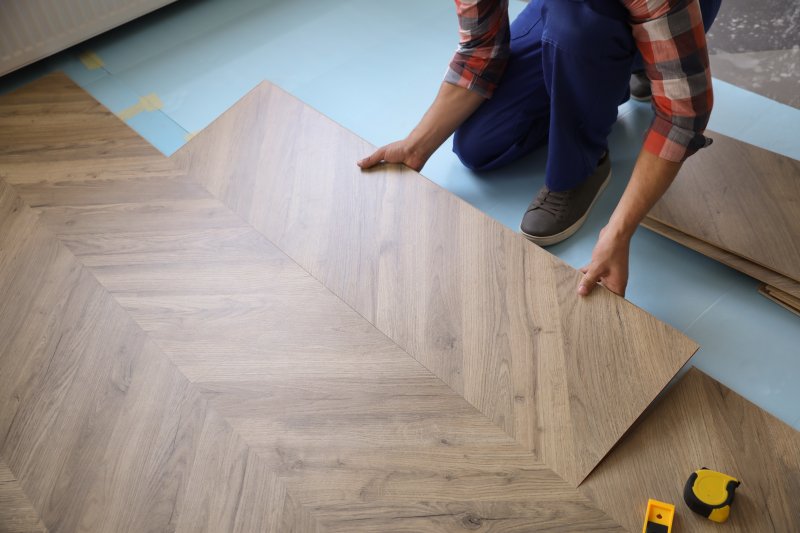 a professional laying laminate flooring 