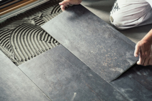 a person working on a tile floor