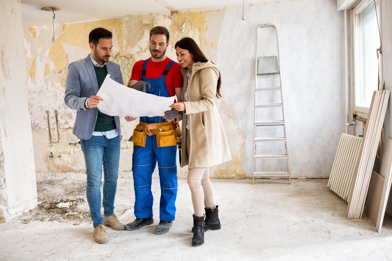 homeowners talking to contractor 