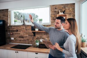 a couple envisioning aspects of a home remodel