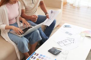 couple on the couch discussing a home remodel